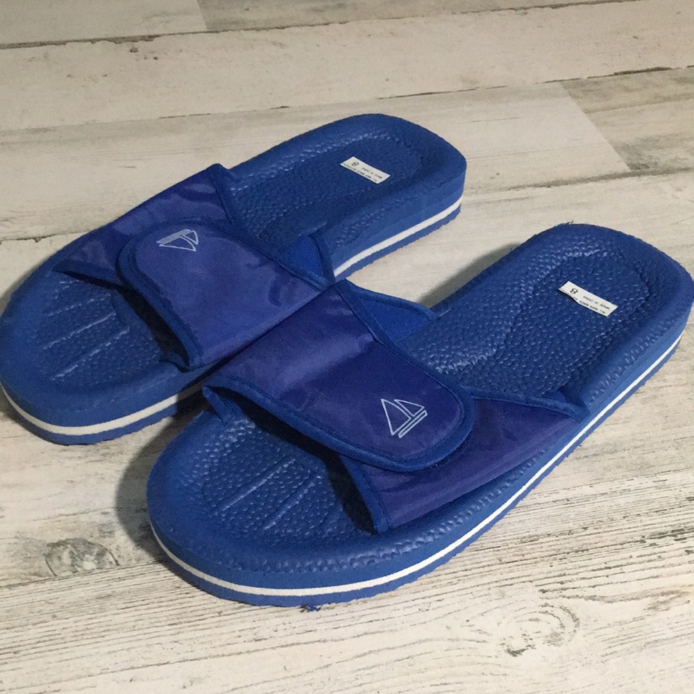 Blue slide sandals w/white stripe around sole & sailboat on Velcro strap size 8
